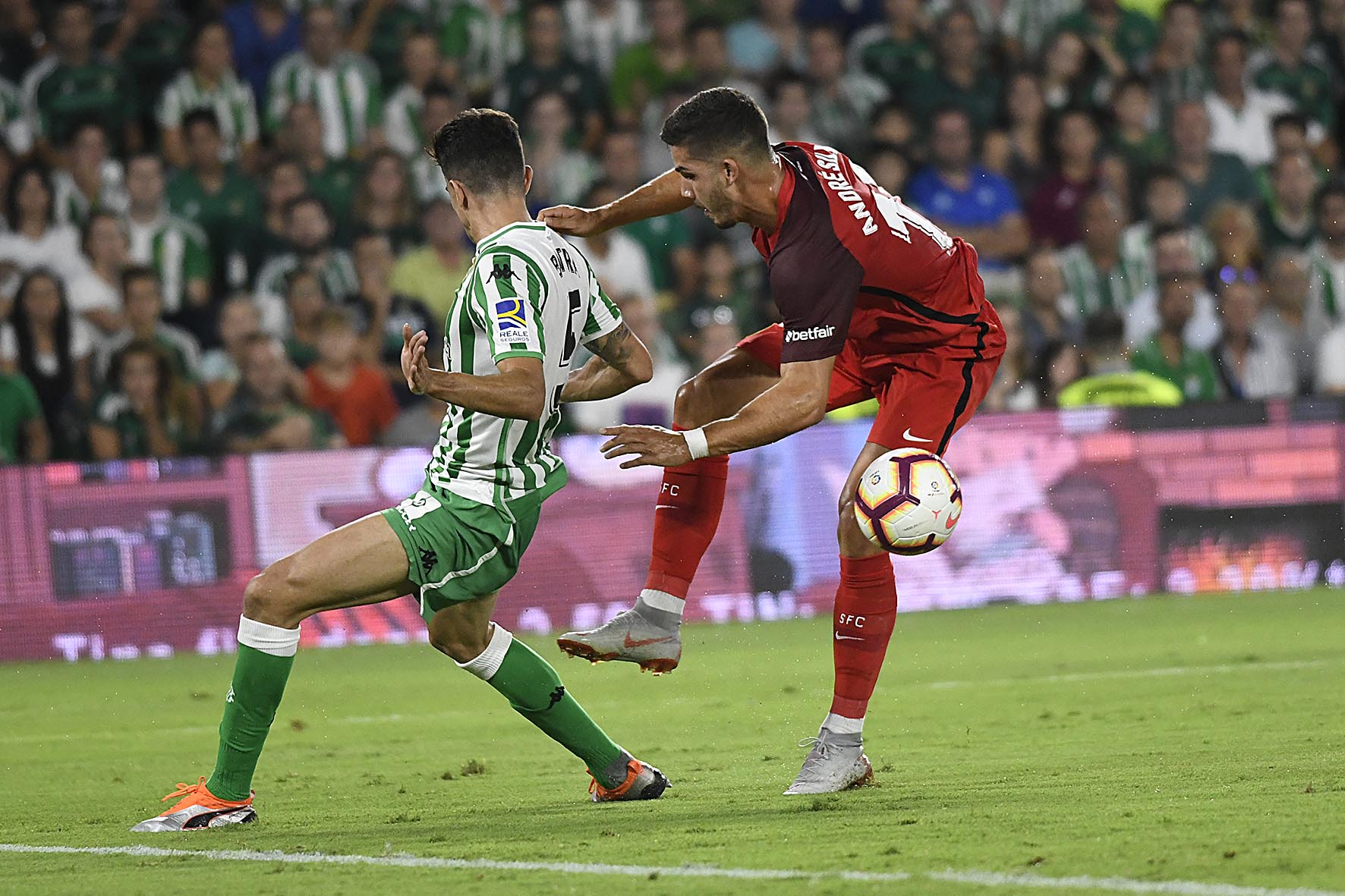 André Silva of Sevilla against Bartra of Real Betis