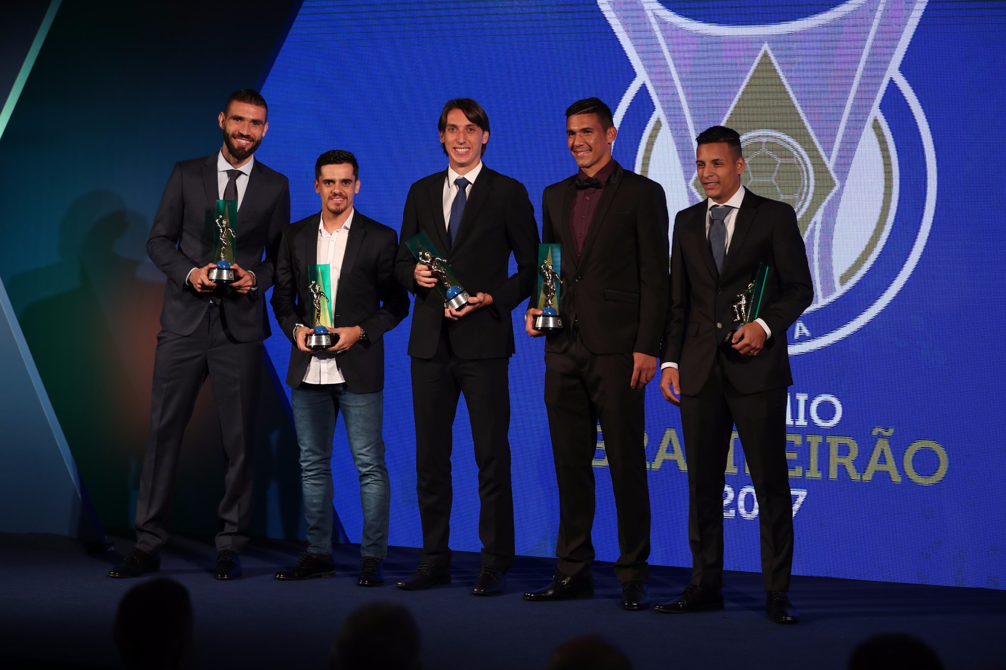 Arana poses with his award alongside Brazil's best back-line