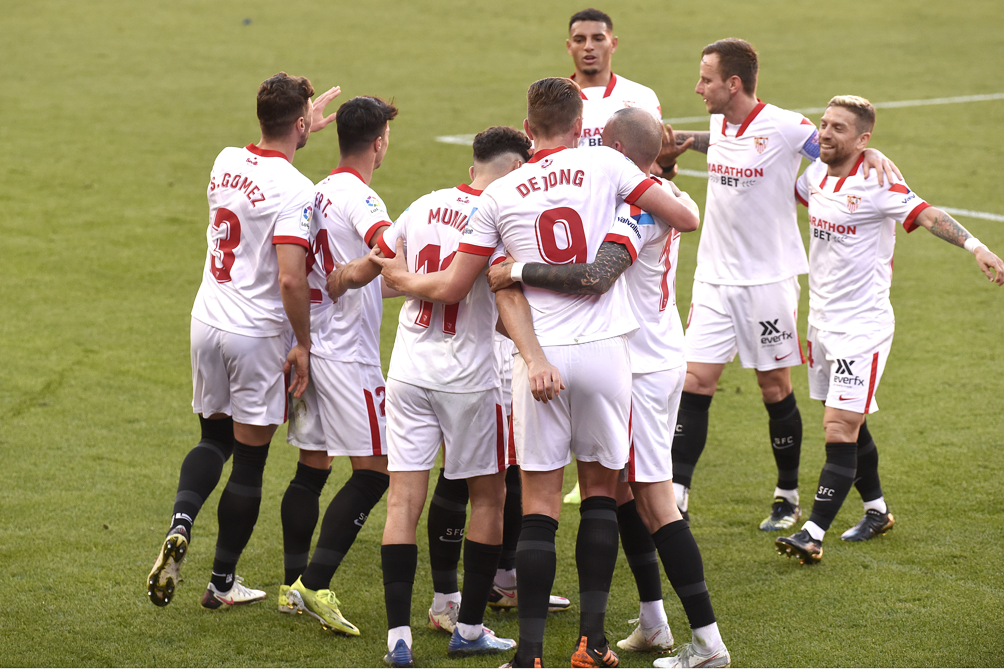 Sevilla FC players celebrate a goal 