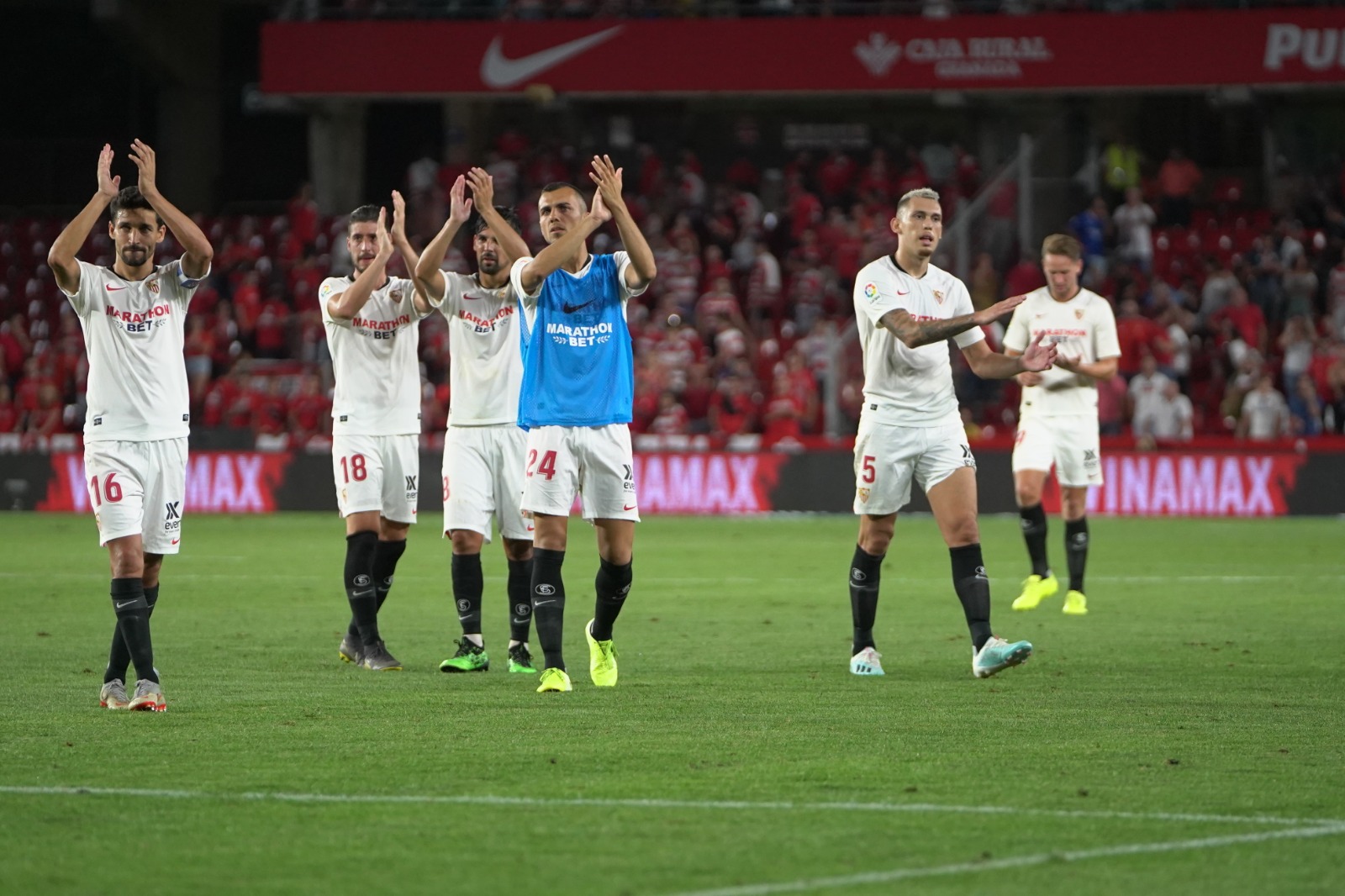 Sevilla FC squad celebrating the win in Granada