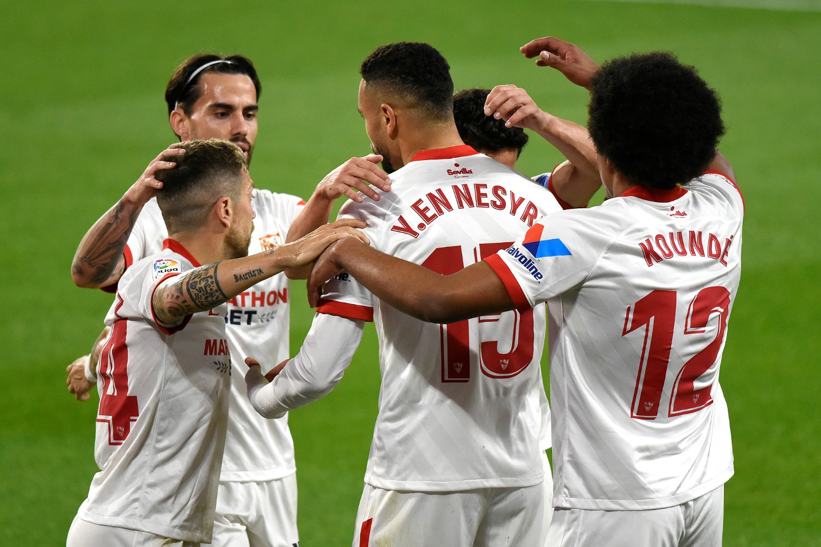 Sevilla players celebrate a goal in El Gran Derbi