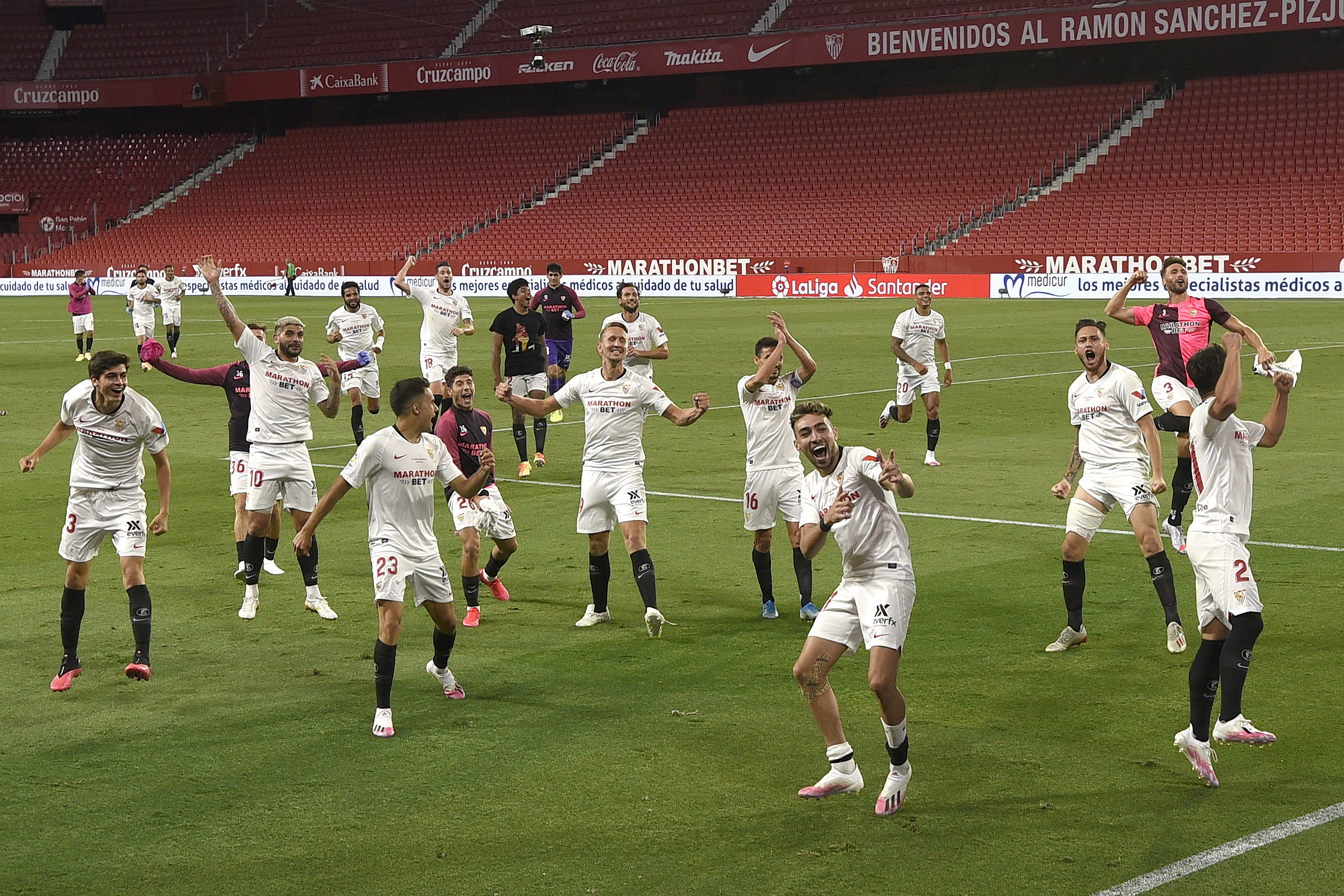 The squad celebrate winning the derby in June