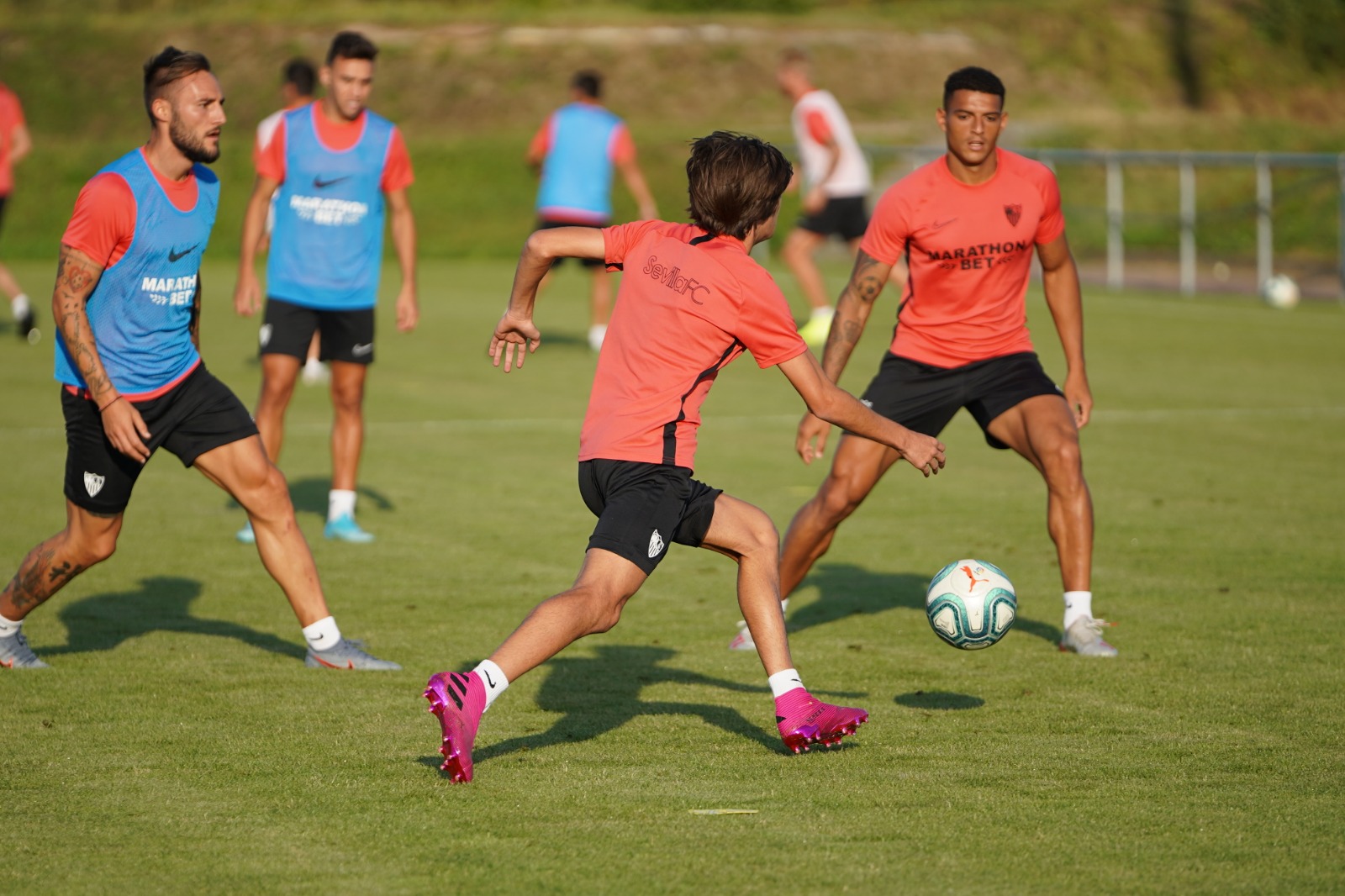 Bryan drives with the ball in training