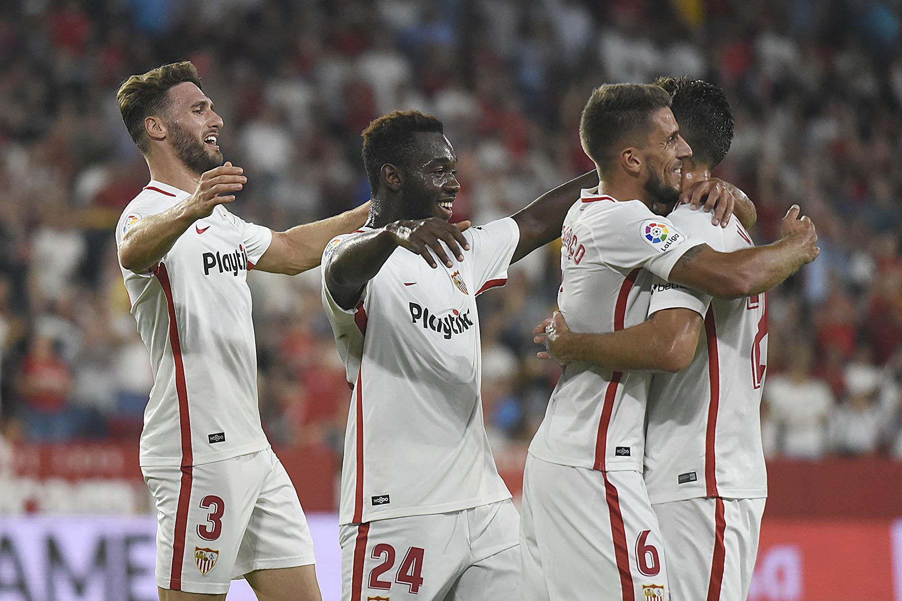 Sevilla's players celebrate a goal