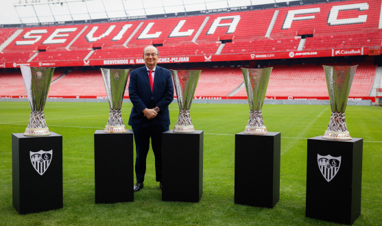 José Castro pictured alongside the five UEFA Europa League titles won during his presidency 