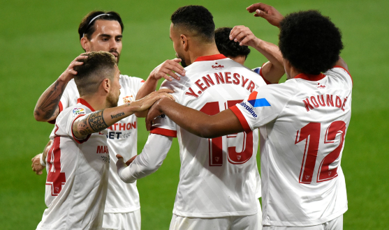 Sevilla players celebrate a goal in El Gran Derbi