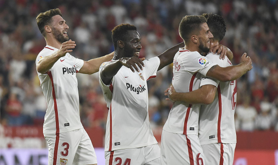 Sevilla's players celebrate a goal